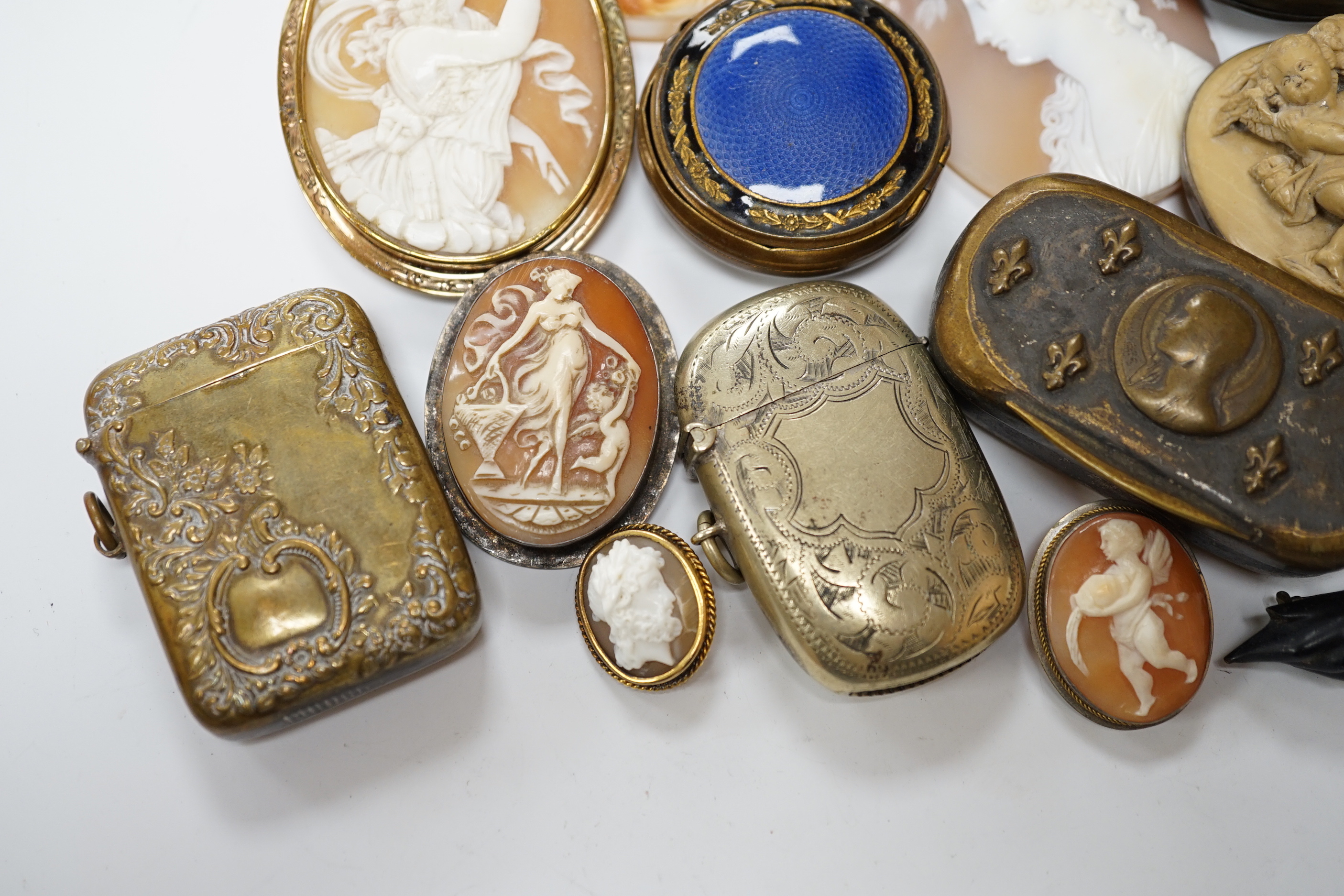 Five assorted unmounted carved cameo shells, largest 57mm, four other mounted cameo brooches including three shell, two base metal vestas and a box and sundry other items.